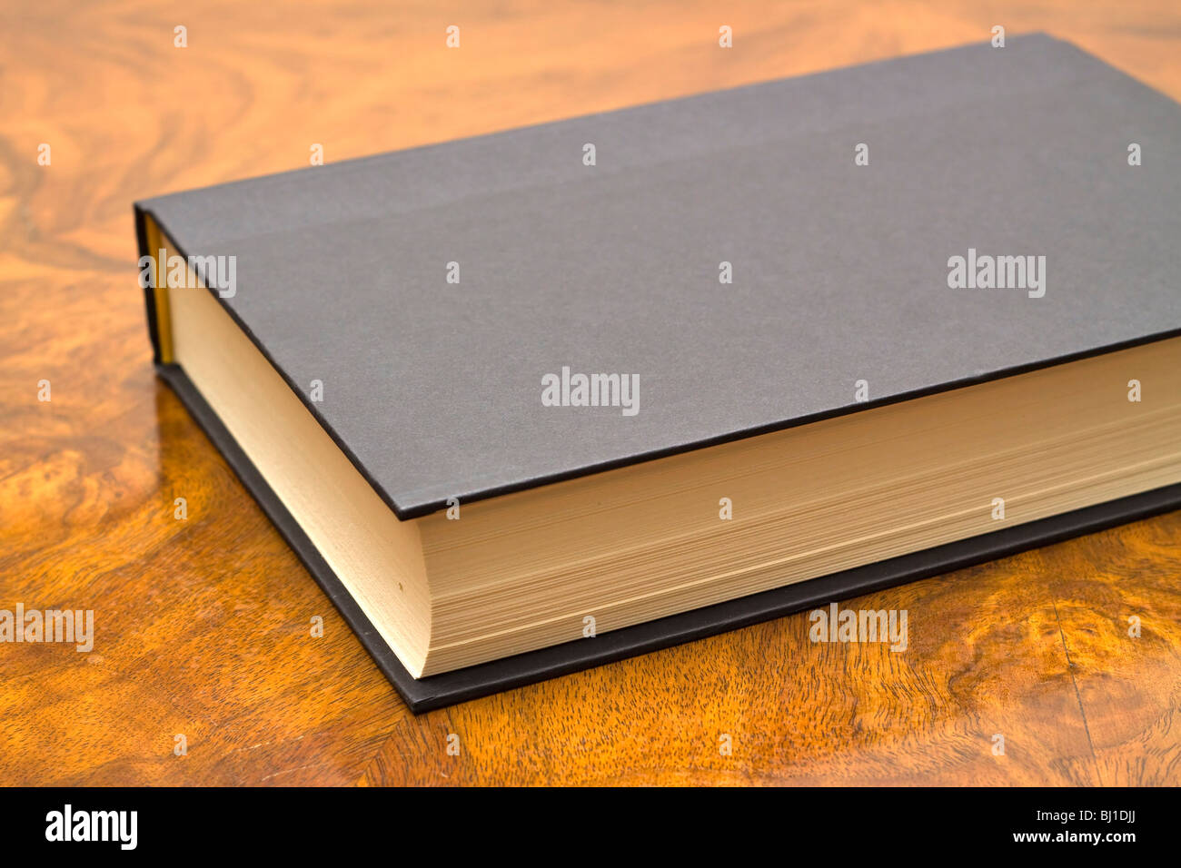 Closed book on table hi-res stock photography and images - Alamy