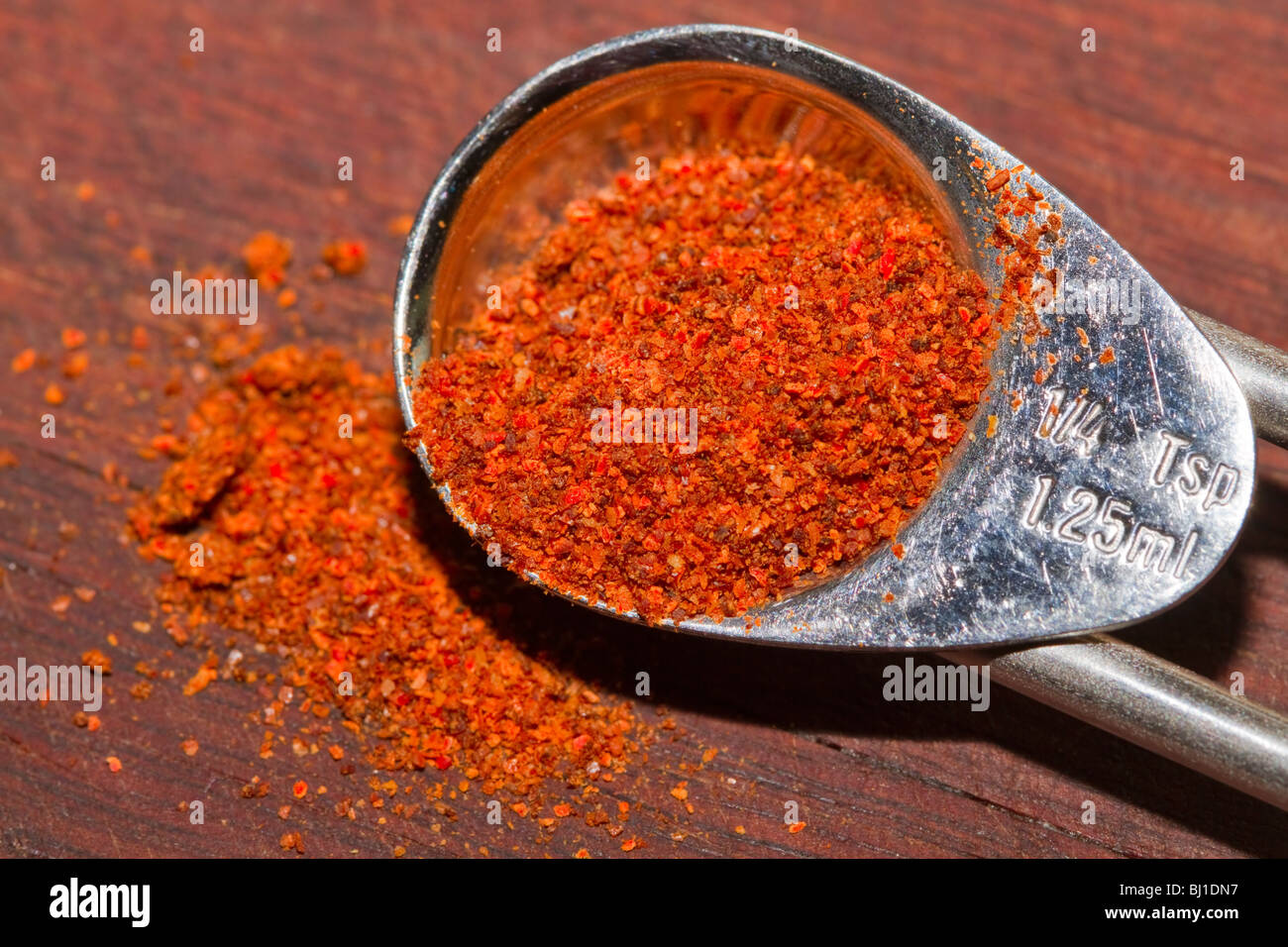 Cayenne pepper in a measuring spoon Stock Photo