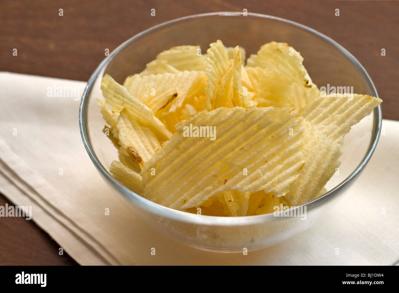A bowl of potato crisps Stock Photo