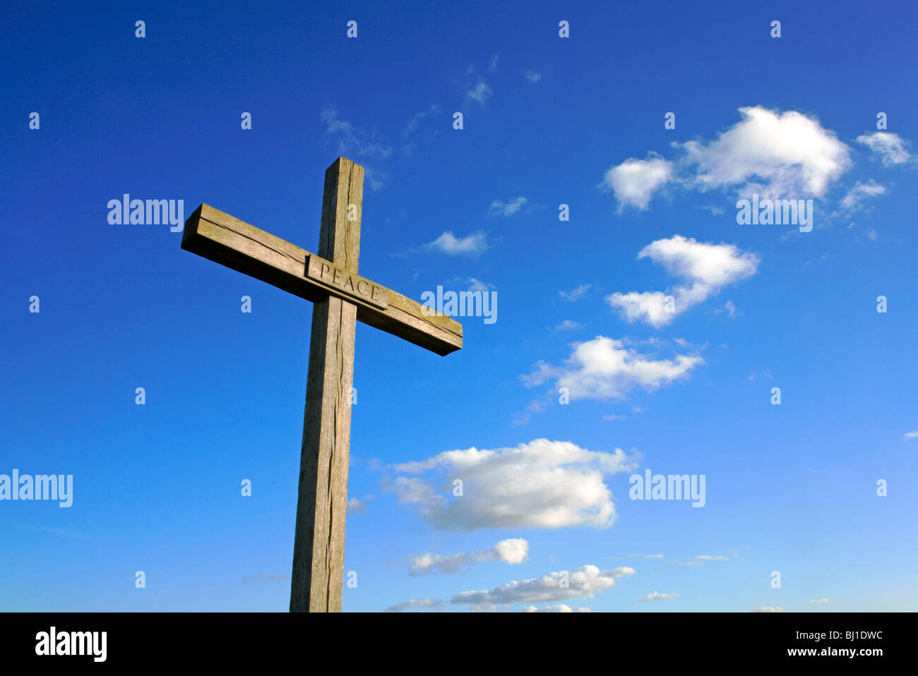 Wooden cross on the site of the altar at St Benet's Abbey, near Horning, Norfolk, United Kingdom. Stock Photo