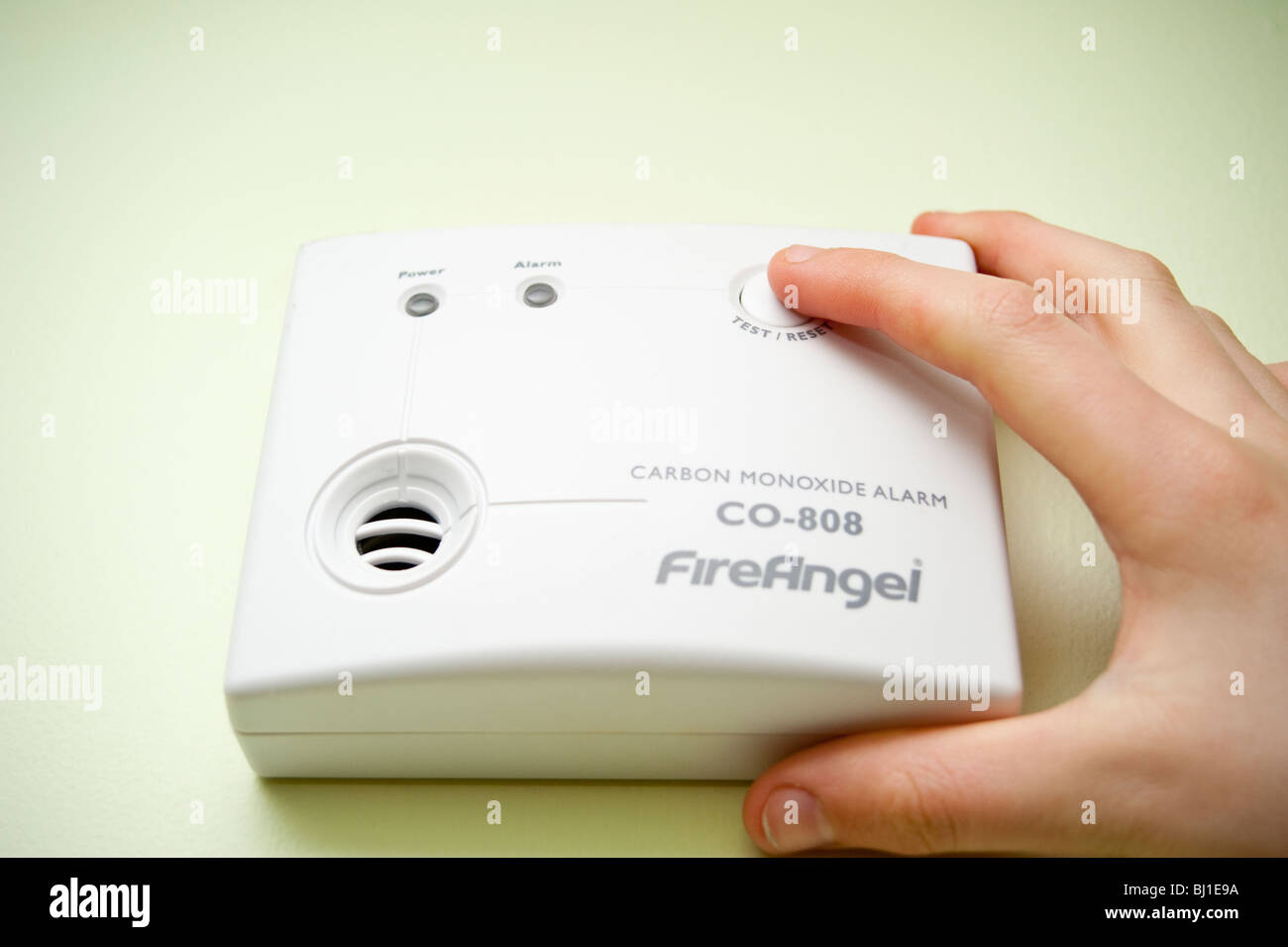A MODEL RELEASED picture of someone testing the Fire Angel carbon monoxide alarm in the uk Stock Photo