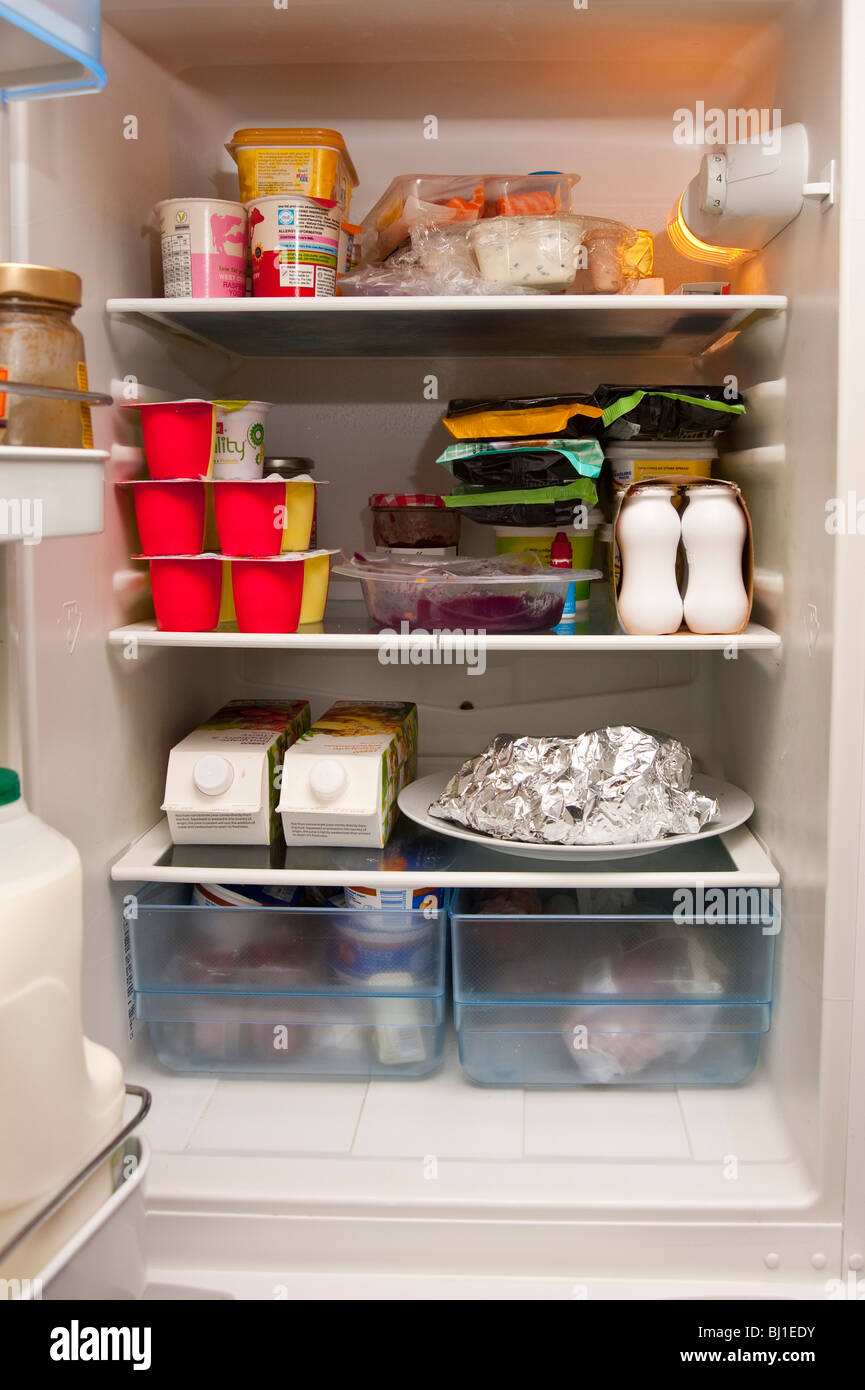 The interior of a fridge with food inside Stock Photo