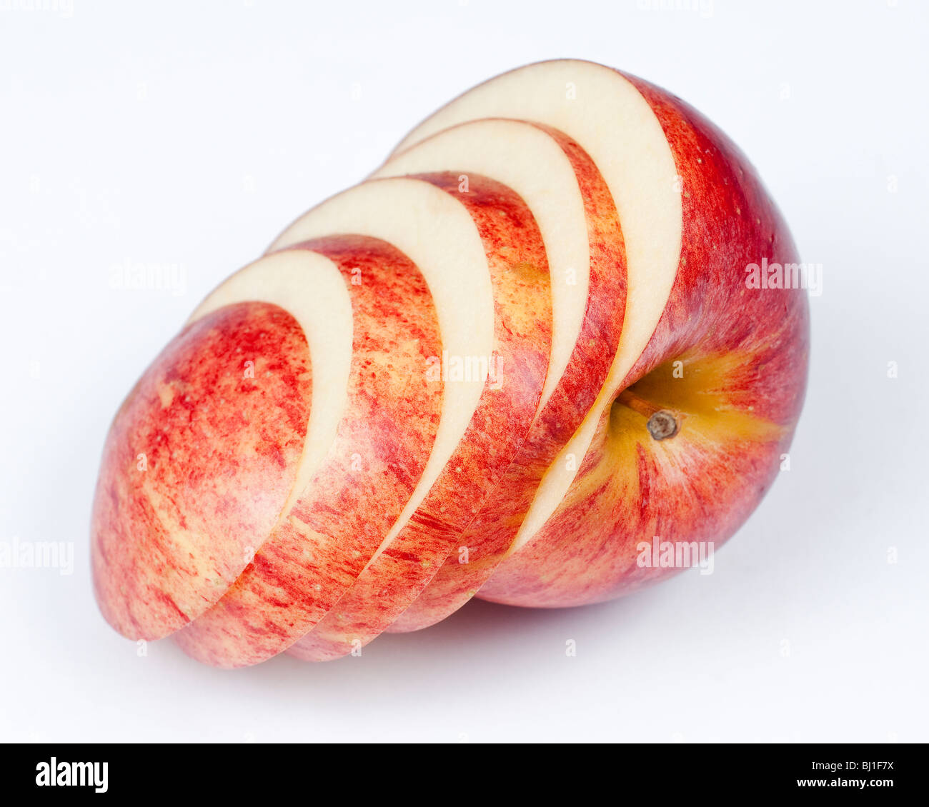 A sliced red apple isolated on white background. Stock Photo
