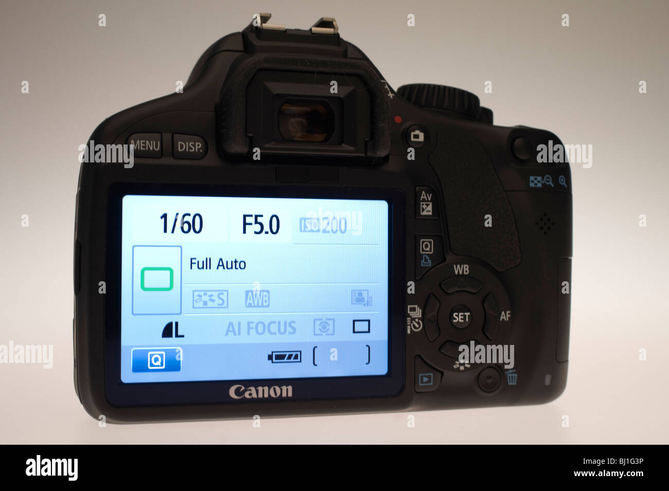 Canon EOS 550D or Digital Rebel 2Ti digital SLR camera with movie function March 2010. Rear 3 inch LCD showing user interface. Stock Photo