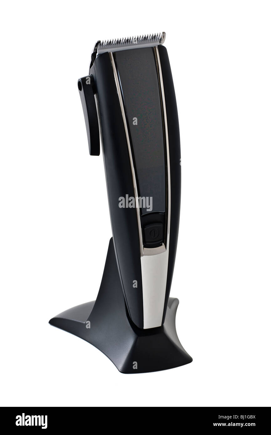 Black ceramic bladed adjustable portable electric hair clippers on a black stand Stock Photo