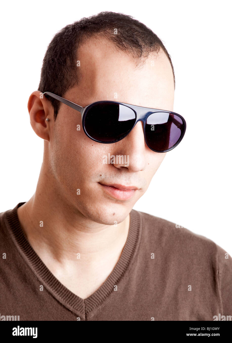 Portrait of a confident young man with sunglasses, isolated on white ...