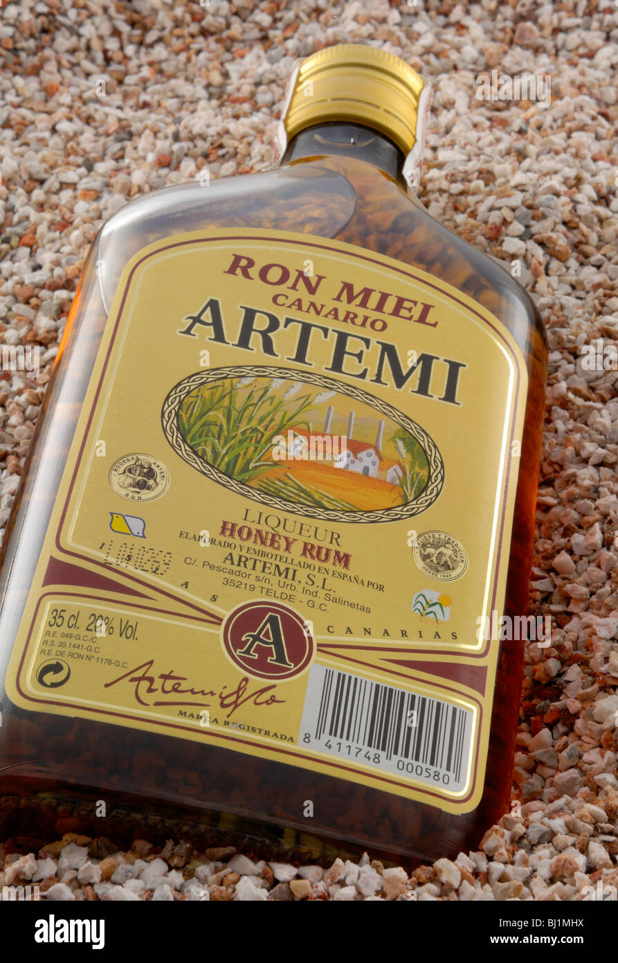 A bottle of local Ron Miel, Honey Rum. Ron Miel is more liqueur than rum. Barranco de Guayadeque, Guayadeque Ravine. Cueva ..... Stock Photo