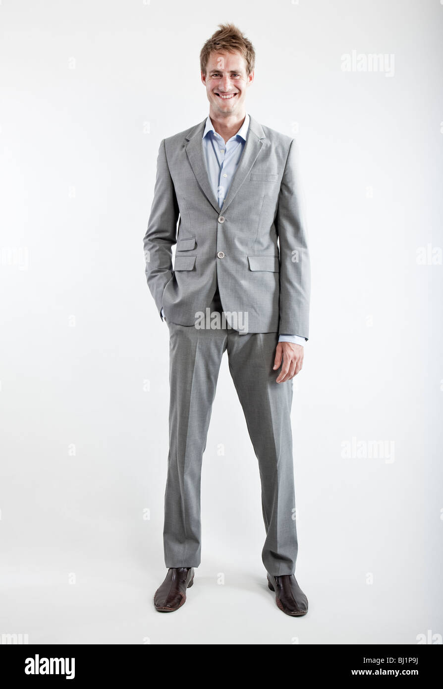 business man in grey suit on white background in studio Stock Photo - Alamy