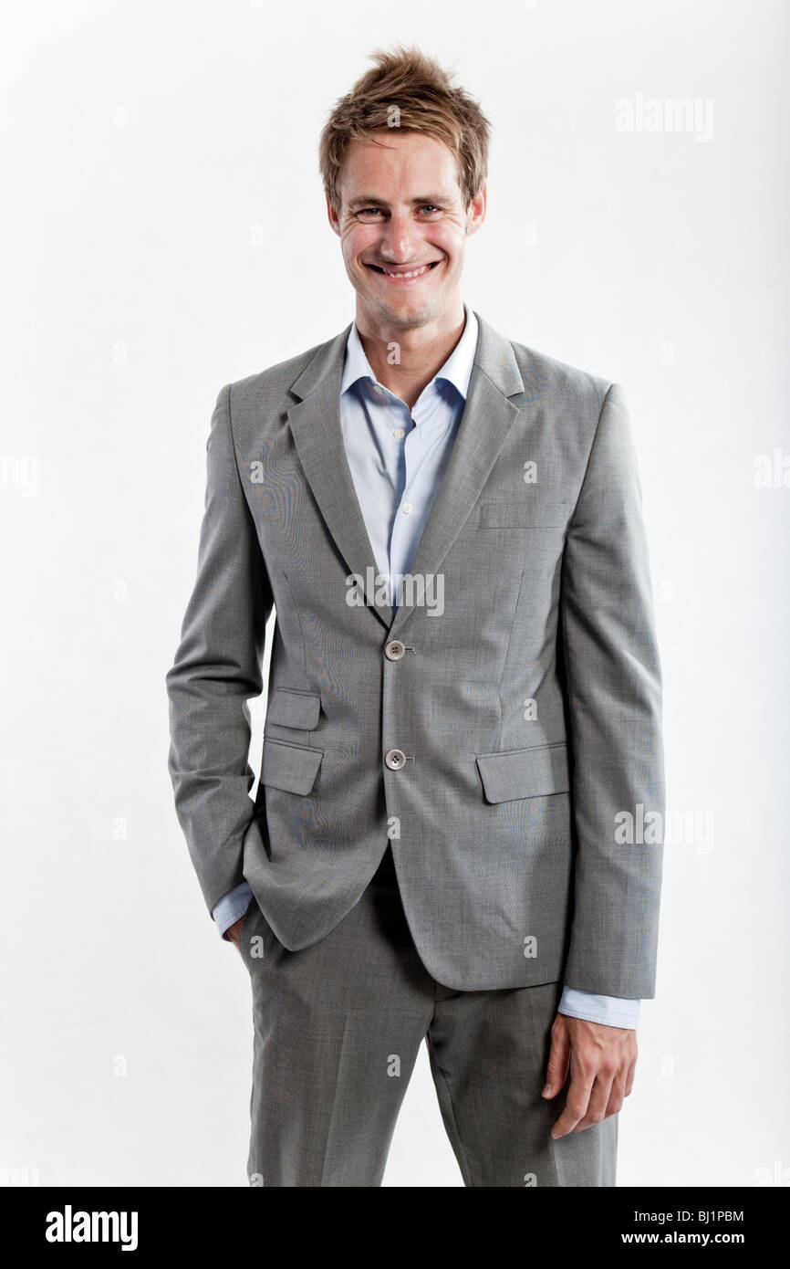 business man in grey suit on white background in studio Stock Photo - Alamy