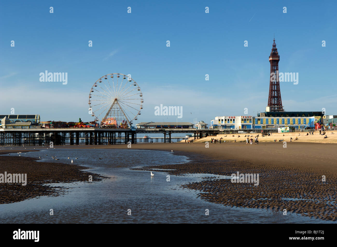 Blackpool Tower, the piers and the Pleasure Beach are the landmarks of Blackpool's Golden Mile, Lancashire, United Kingdom Stock Photo