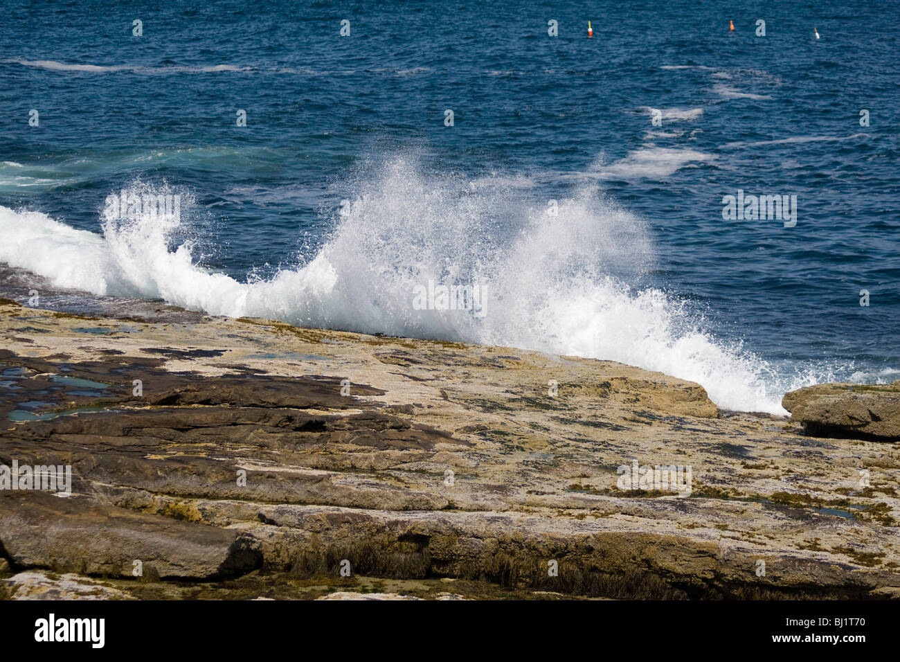 Surf breaks on the rocks along the east side of Damariscove Island, Maine Stock Photo