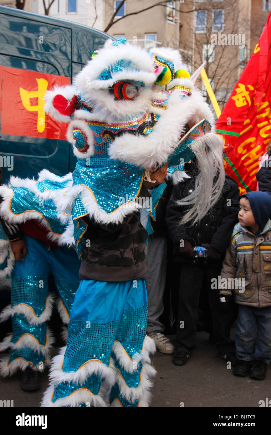 A traditional dragon dance at the Chinese New Year parade in the streets of Paris, France Stock Photo