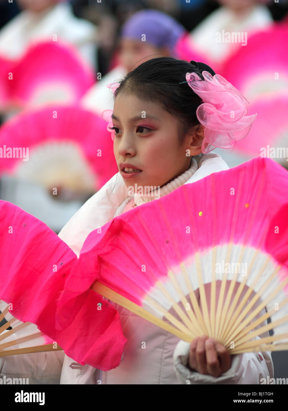 A young dancer performing the fan dance at the Chinese New Year parade