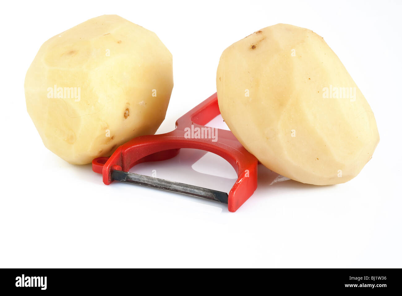 plastic potato pealer and two peeled potatoes isolated on white