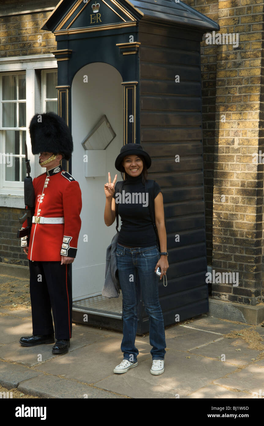 Tourist and guard, St James' Palace, The Mall, London, England Stock Photo