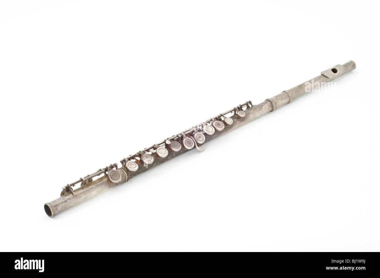 Old tarnished flute Stock Photo