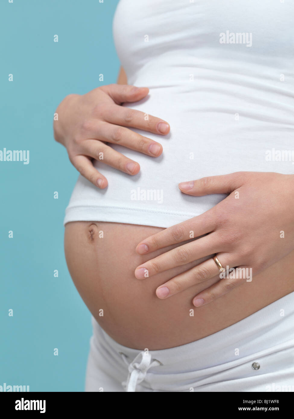 Six months pregnant belly