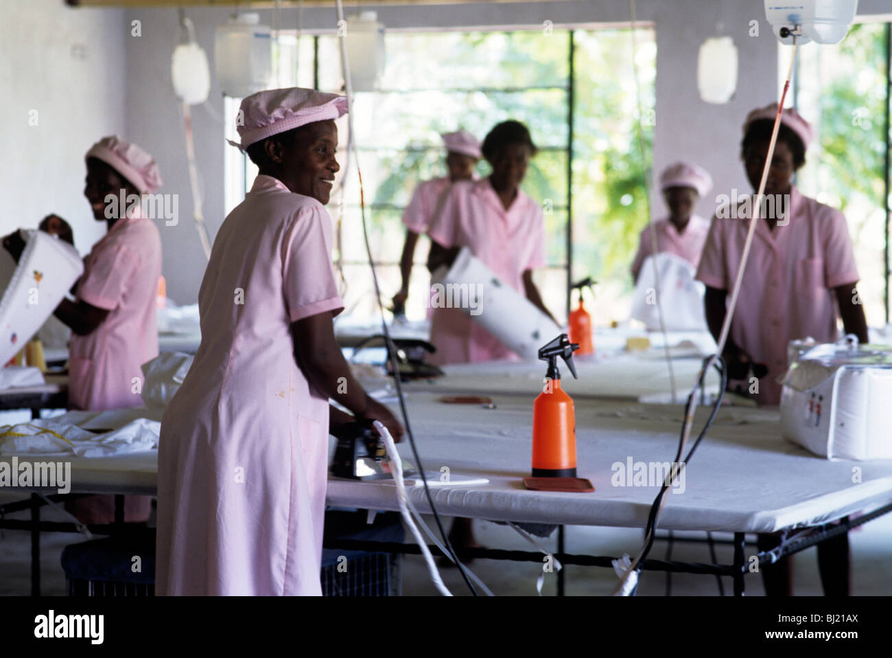 Black female factory workers preparing linen, Zimbabwe Stock Photo Alamy