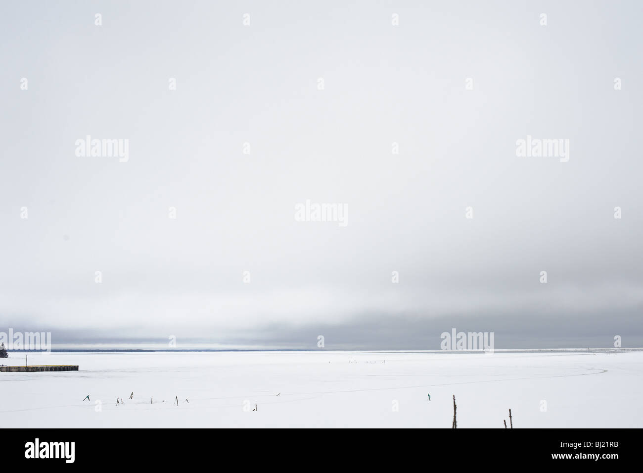 Smelt fishing nets and poles on the frozen Chaleur Bay New Brunswick Canada Stock Photo