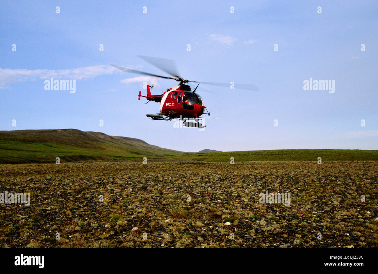 Helicopter above the tundra, the Arctic, Canada. Stock Photo