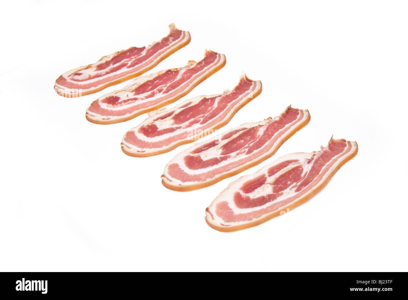 Streaky bacon rashers isolated on a white studio background Stock Photo