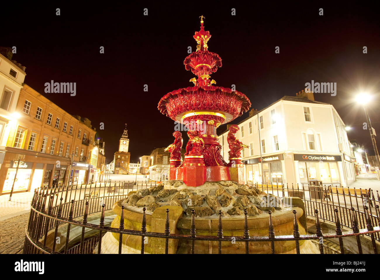 Dusk in Dumfries town centre Fountain in Queensberry Square looking up