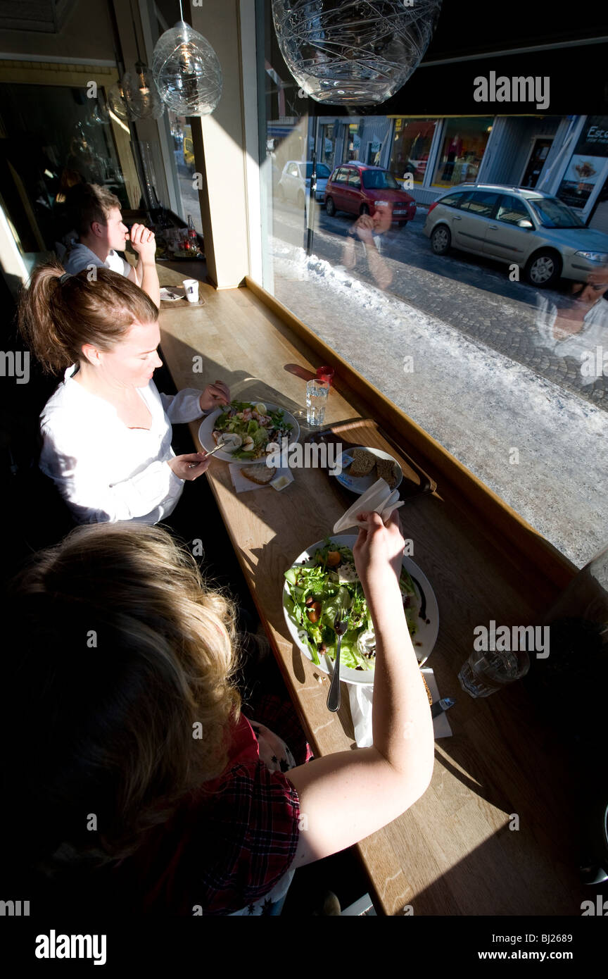sisters eating at restaurant Stock Photo