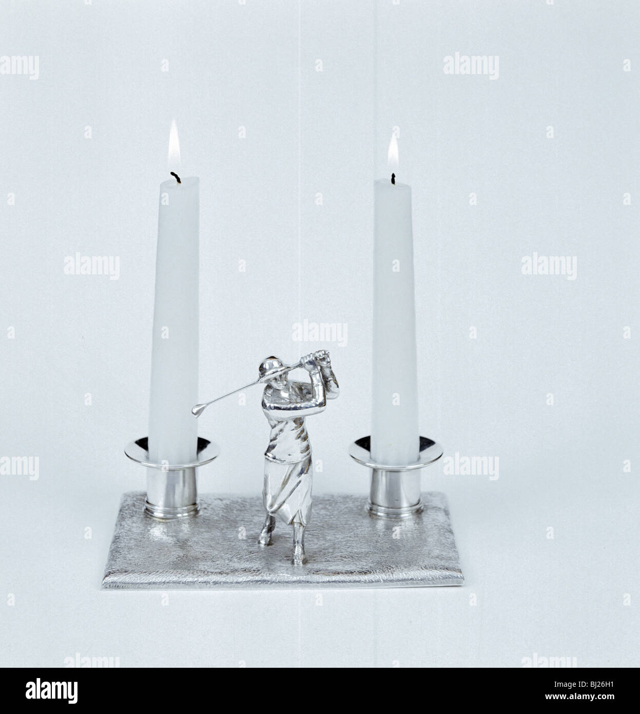 Silver candleholder with female golfer figure, 1930s. Artist: Unknown Stock Photo