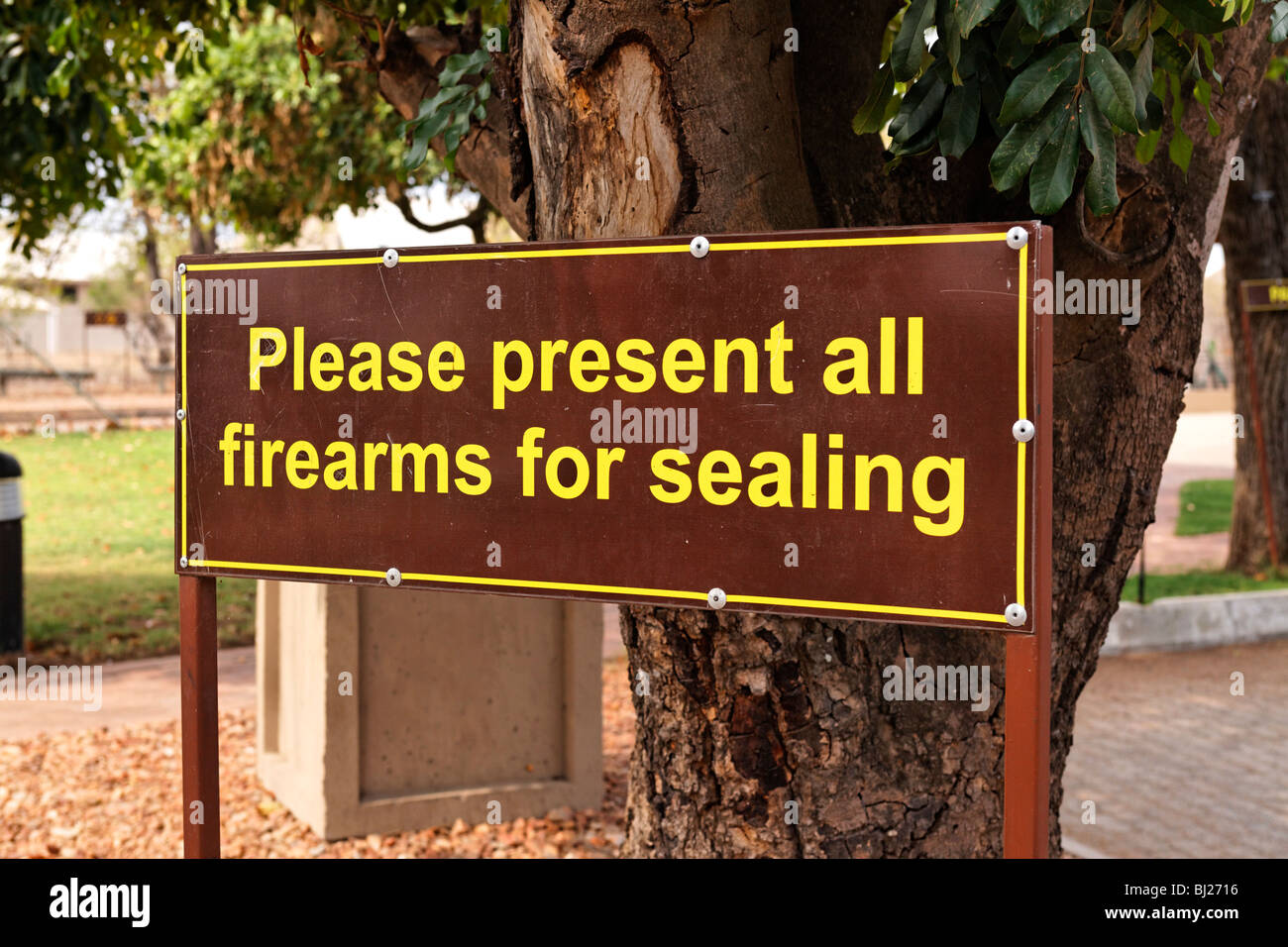 Present firearms for sealing sign Phalaborwa Gate Kruger National Park South Africa Stock Photo