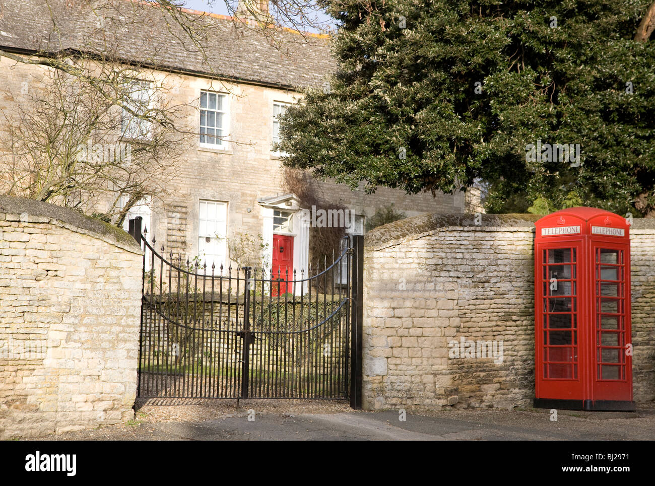 House and telephone box in Northamptonshire village, England Stock