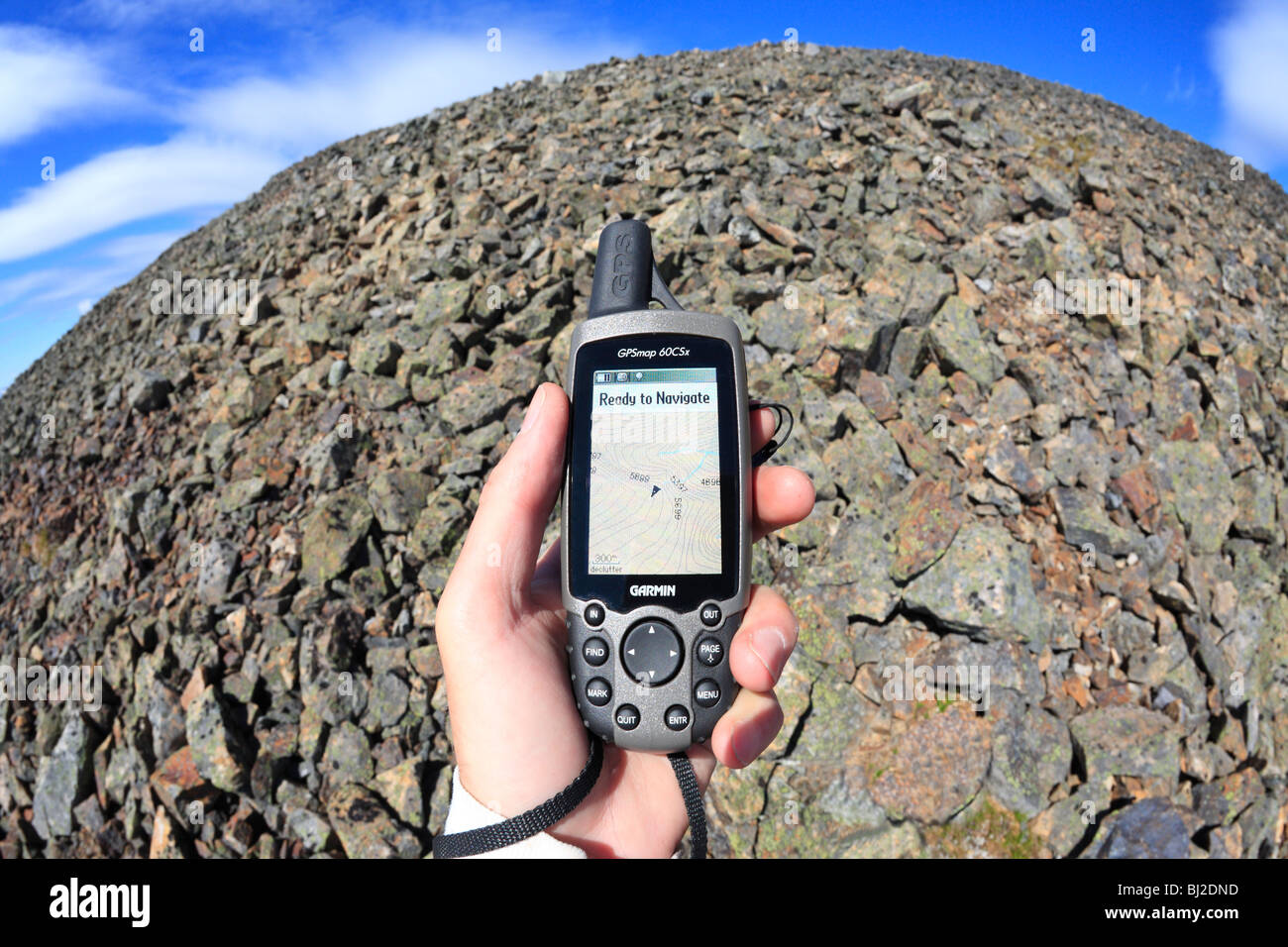 Hiker holding GPS unit, Hudson Bay Mountain, Smithers, British Columbia Stock Photo