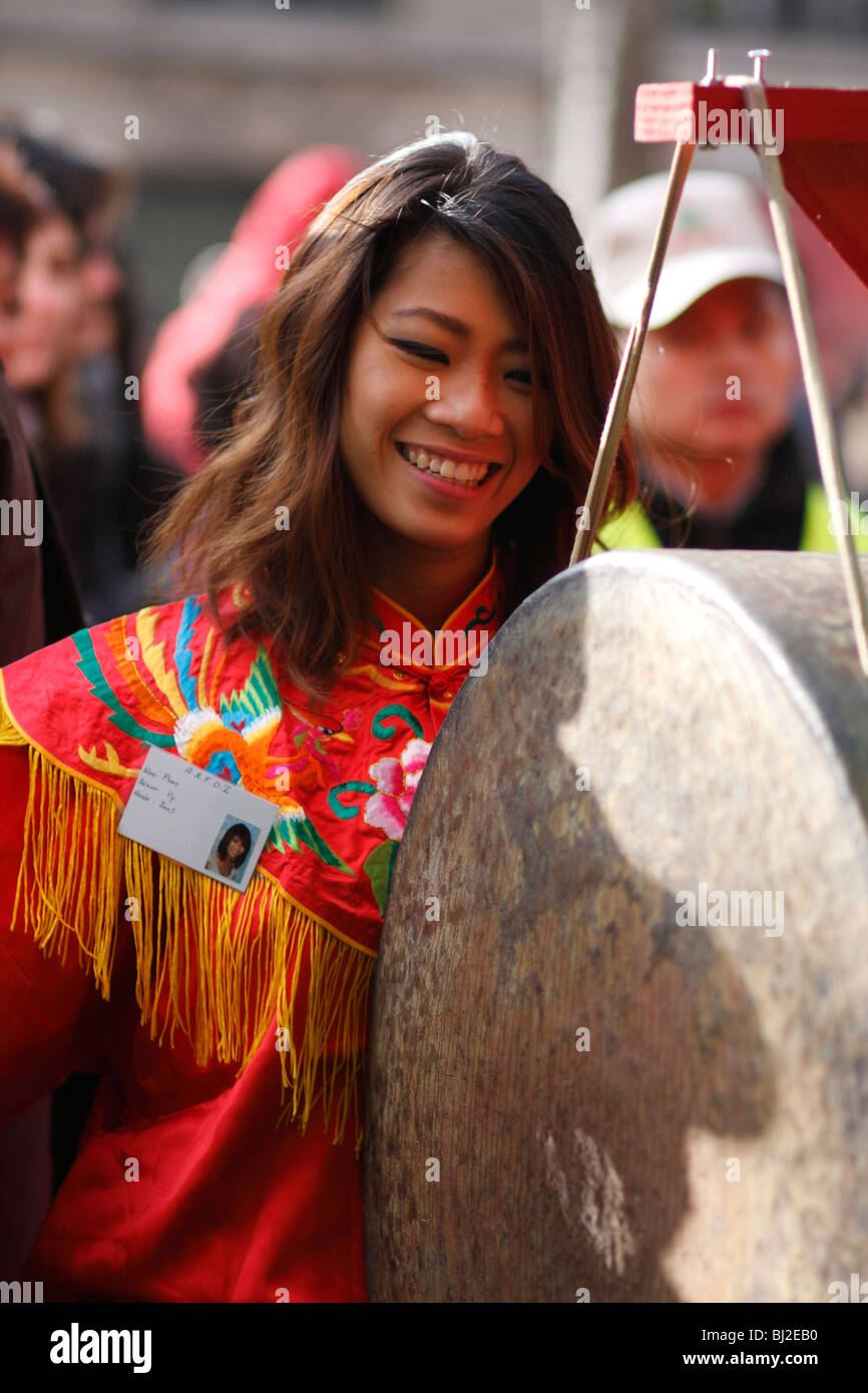 A young musician performing at the Chinese New Year parade in the