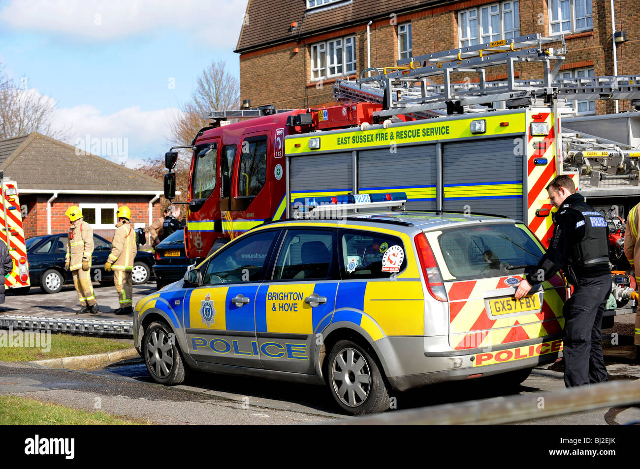 Police and firefighters working at the scene of a serious house fire in Brighton Stock Photo