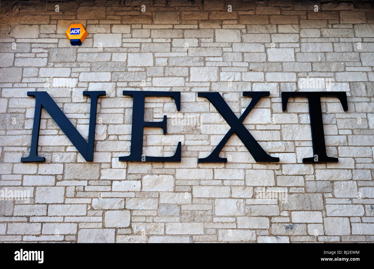 NEXT, clothing store logo. The Old Showground, Kendal, Cumbria, England
