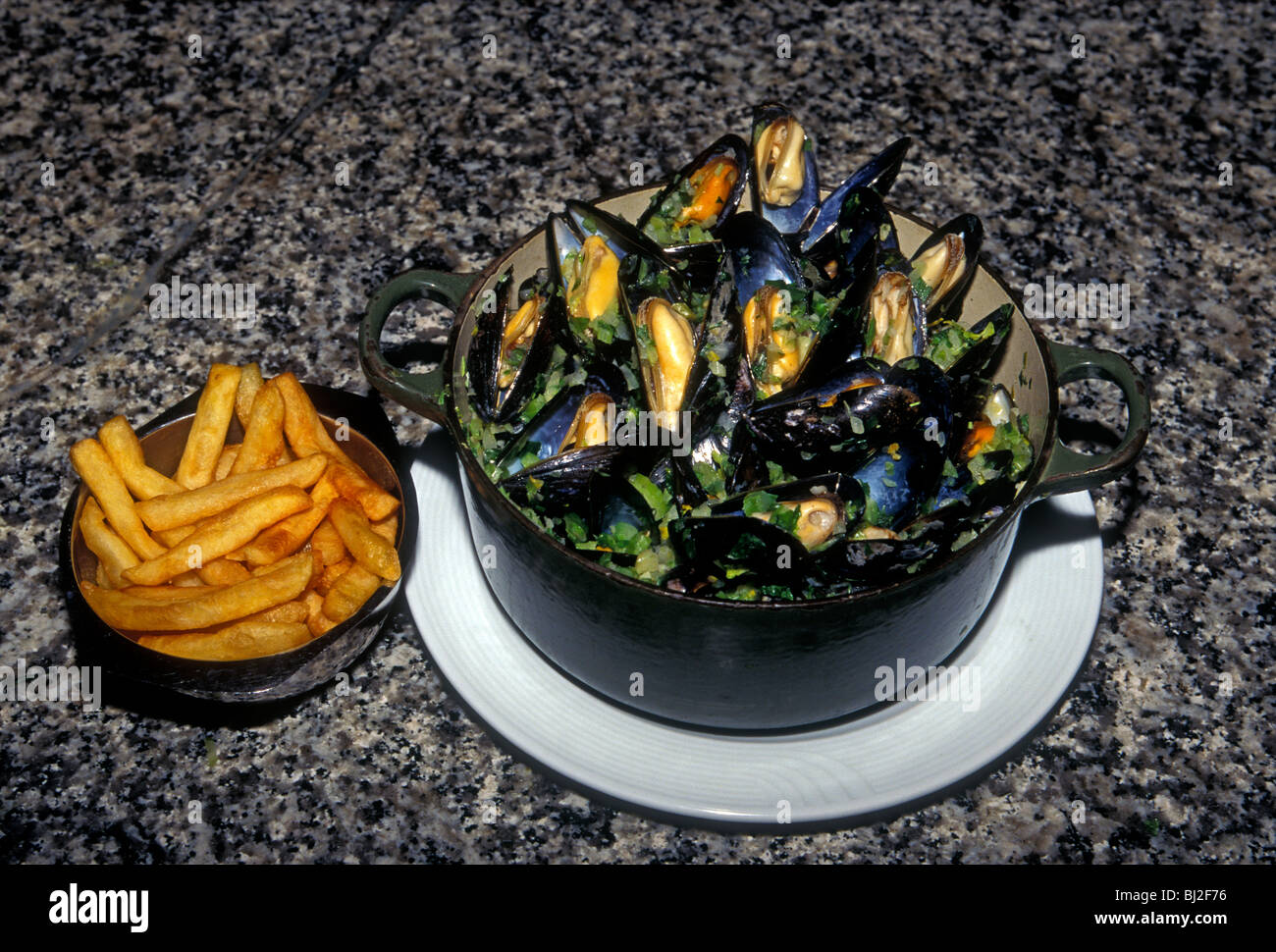 bowl of mussels, mussels, moules marinieres, white wine sauce, au vin blanc, French fries
