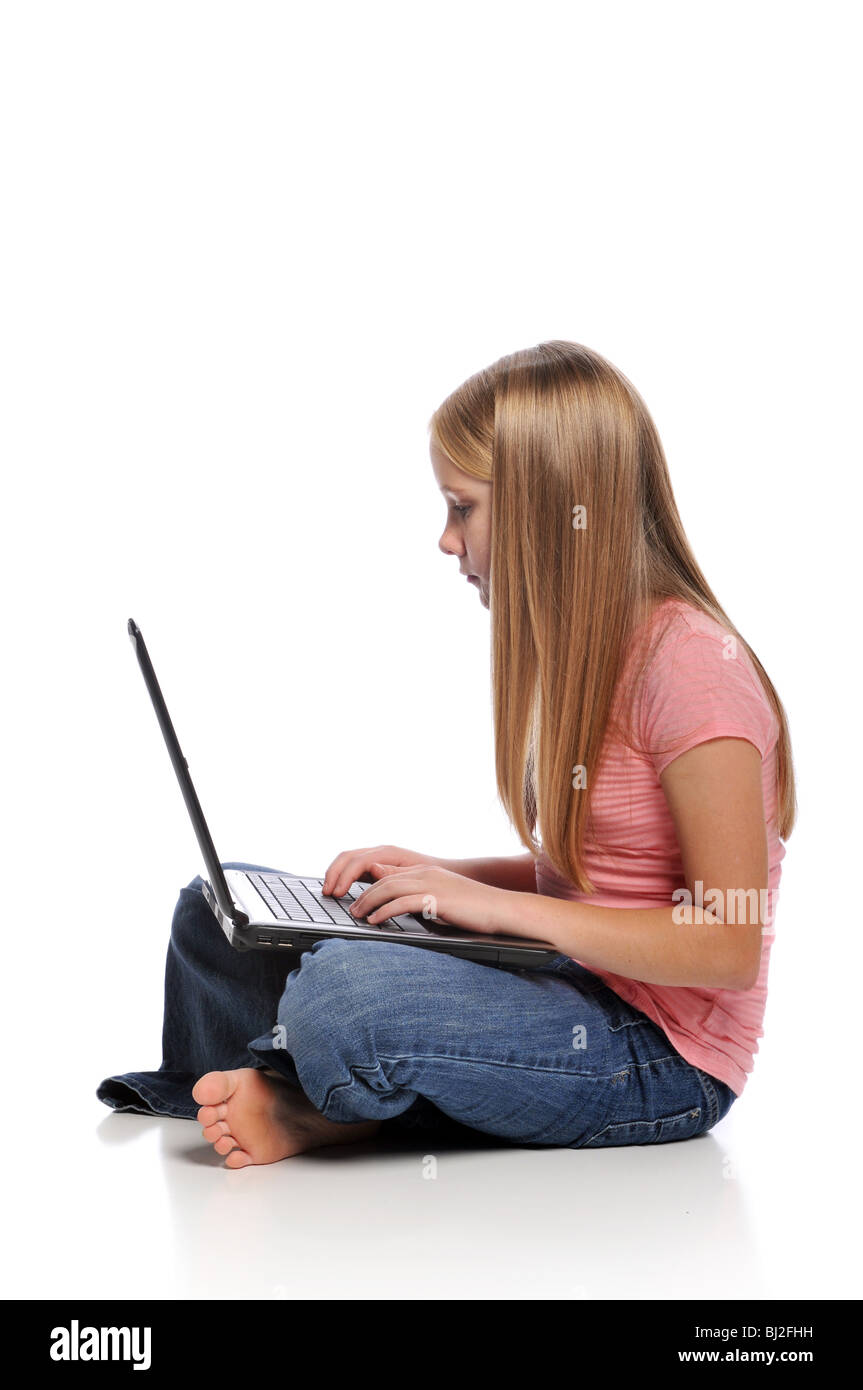 Little girl with laptop computer isolated on a white background Stock ...