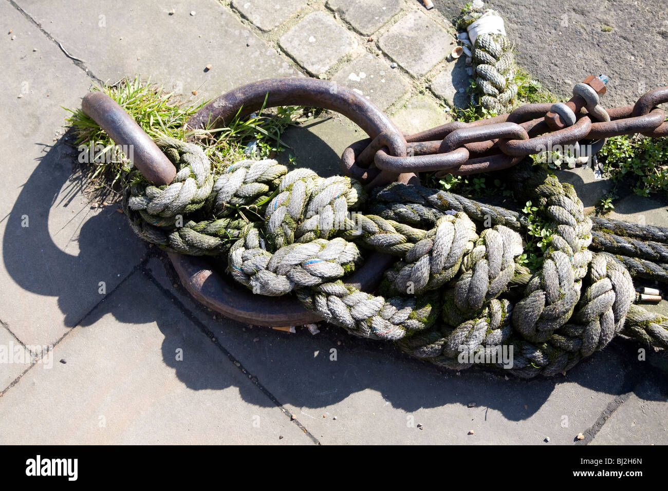 Mooring ring with ropes Stock Photo