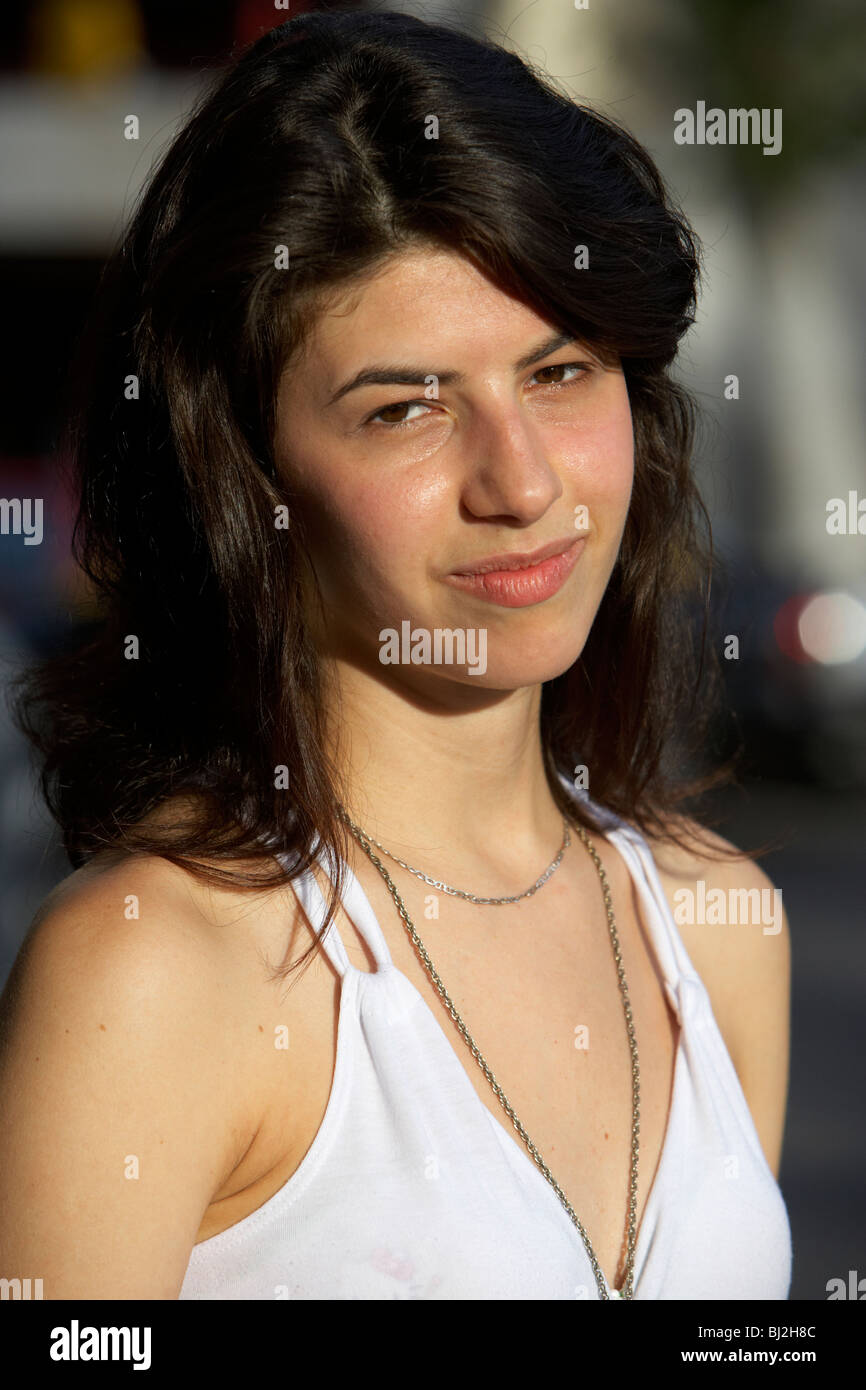 young hispanic latin woman looking to camera with knowing expression in buenos aires argentina Stock Photo