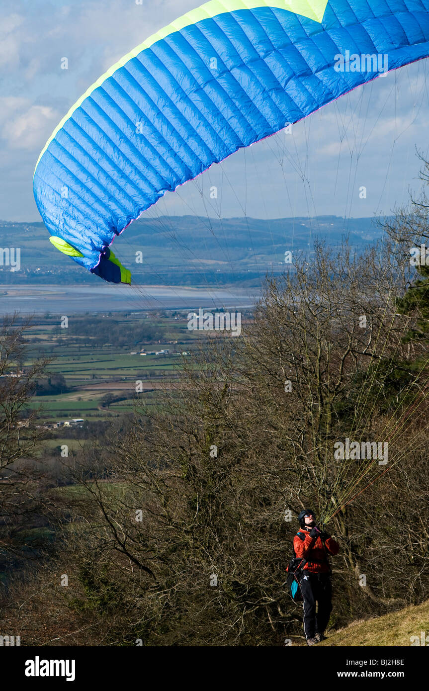 Paraglider preparing to take off from Coaley Peak in The Cotswolds