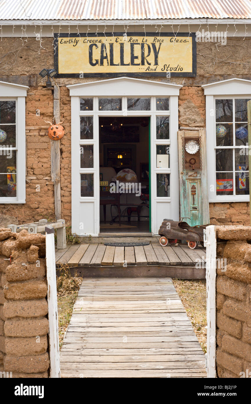 This old adobe building houses the Earthly Greens & Ran La Roca Glass Gallery and Studio, in Lincoln, New Mexico. Stock Photo