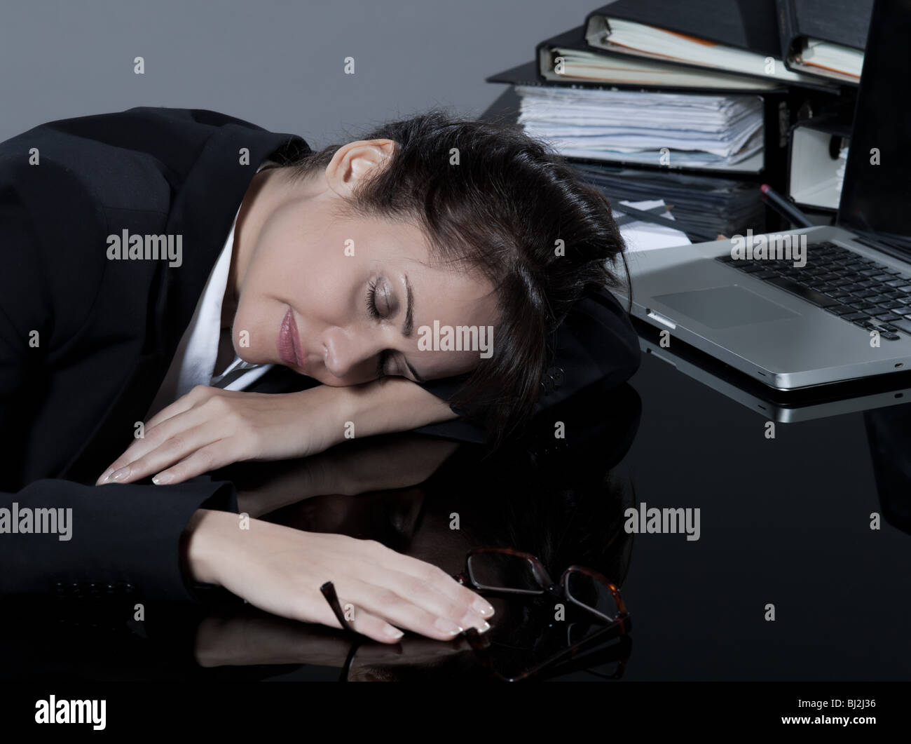 beautiful brunette business woman at her desk sleeping Stock Photo - Alamy