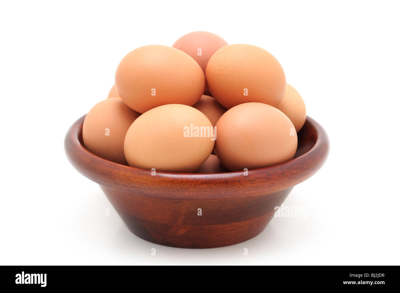 Brown Hen Eggs in a Wooden Bowl Stock Photo