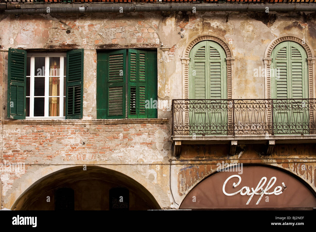 Facade of old building with Caffe sign in historical part of Verona, Italy Stock Photo