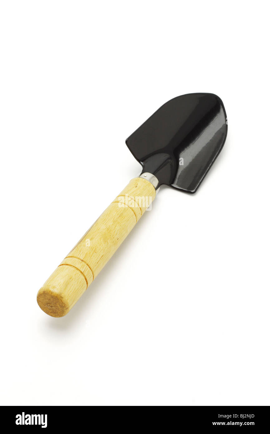 Small garden spade with wooden handle on white background Stock Photo