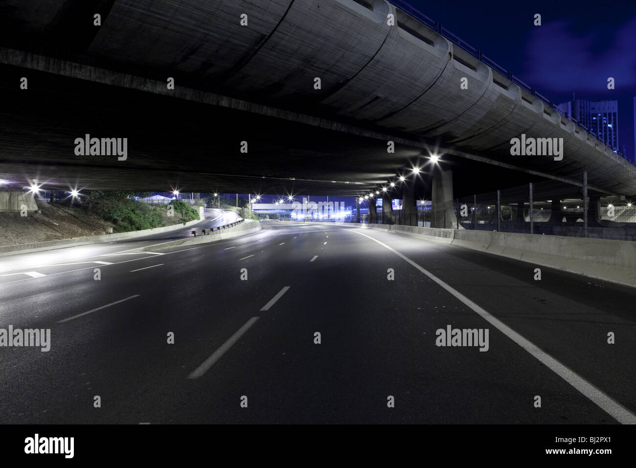 Empty freeway at night Stock Photo