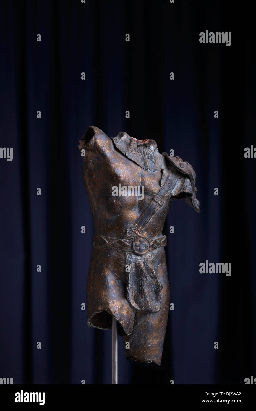 Bronzed clay sculpture of Roman gladiator torso. Stock Photo