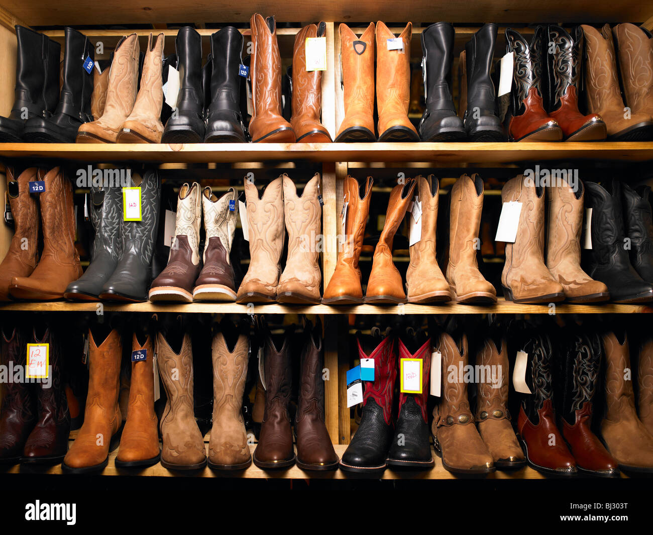 Cowboy boots on shelves Stock Photo Alamy
