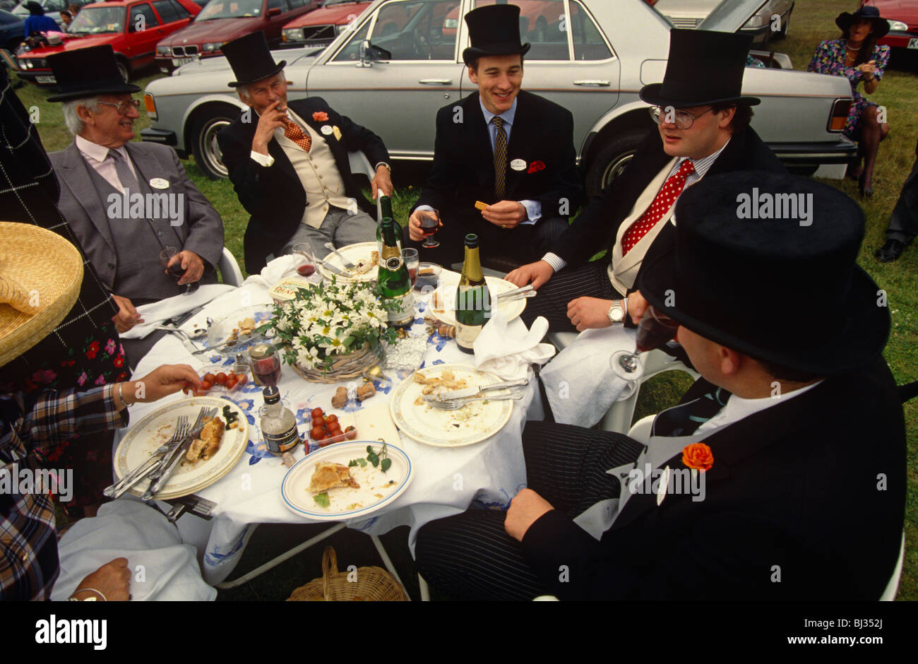 Group of wealthy Ascot race-goers enjoy a boozy picnic in a car park outside the famous racecourse Stock Photo