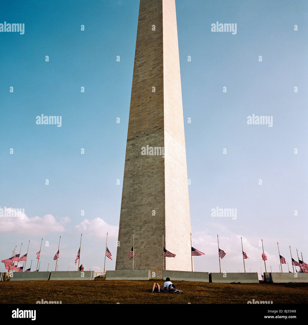 American flags fly at half-mast under the Washington Memorial in the week after the September 11th attacks on the USA. Stock Photo