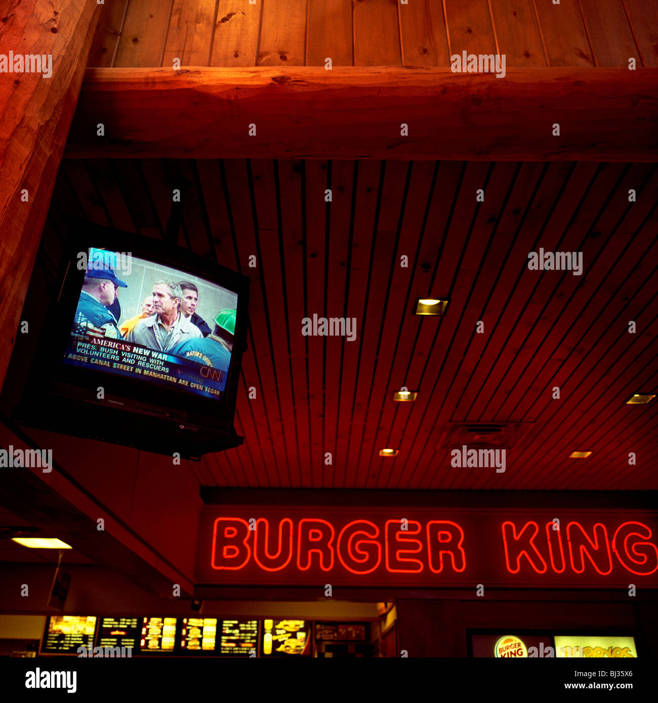 Days after 9/11, President George W Bush tours Ground Zero on CNN TV feed at a New York State rest stop Burger King restaurant. Stock Photo